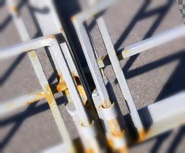 FX №21519 Cover. Two vertical metal bolts on the iron gate.